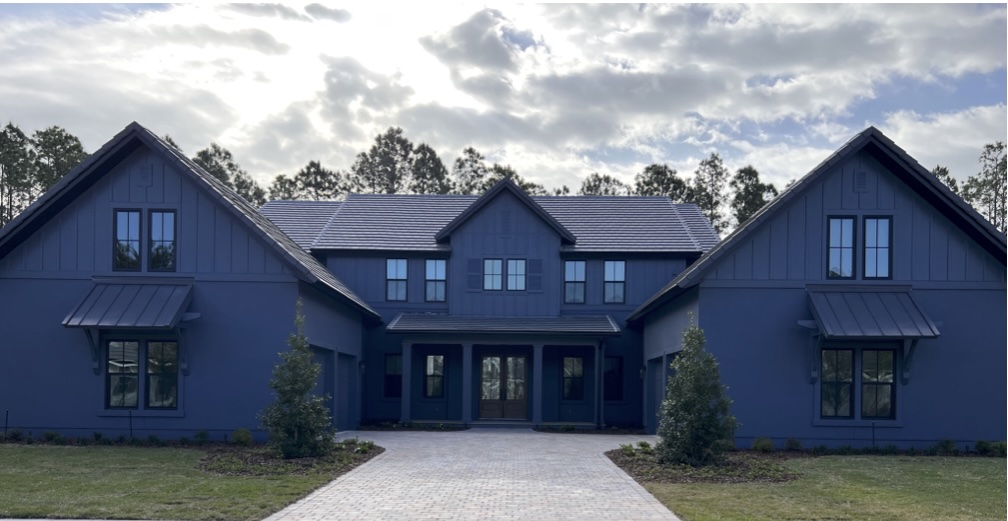 Our client wanted something bold and we opted for this dark monochromatic exterior paint color for their home.